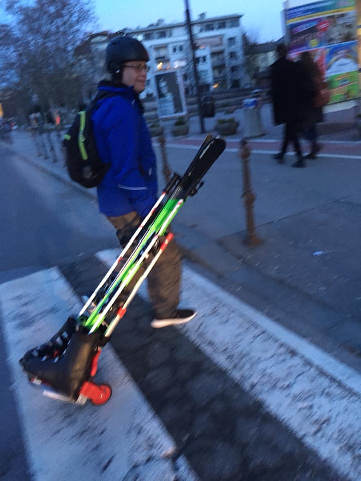 Dr. Smith Walking with skiis To Bus Station.jpeg.